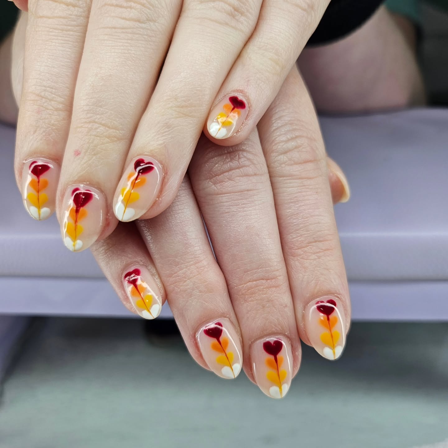 Nail art with floral and golden accents