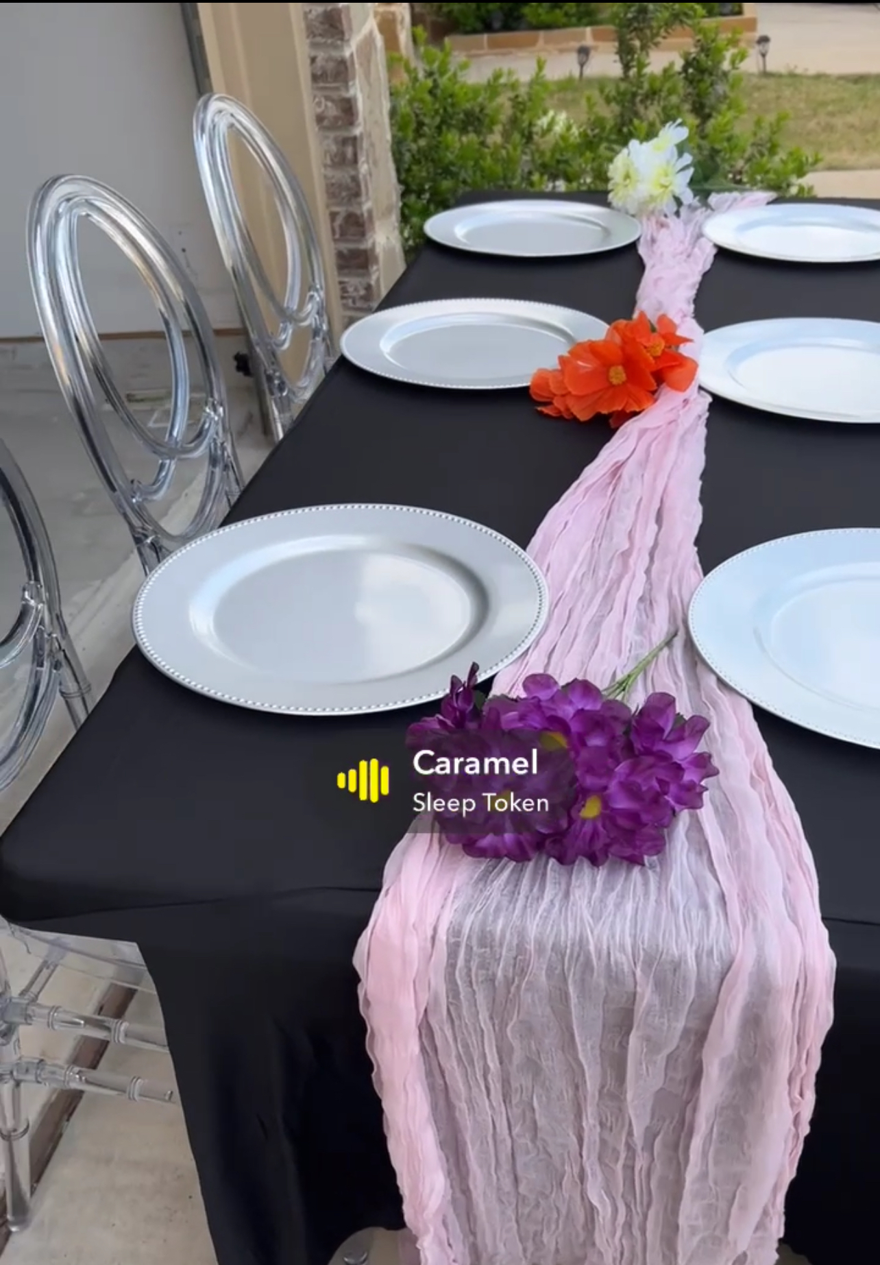 Acrylic chairs with table setup and pink runner