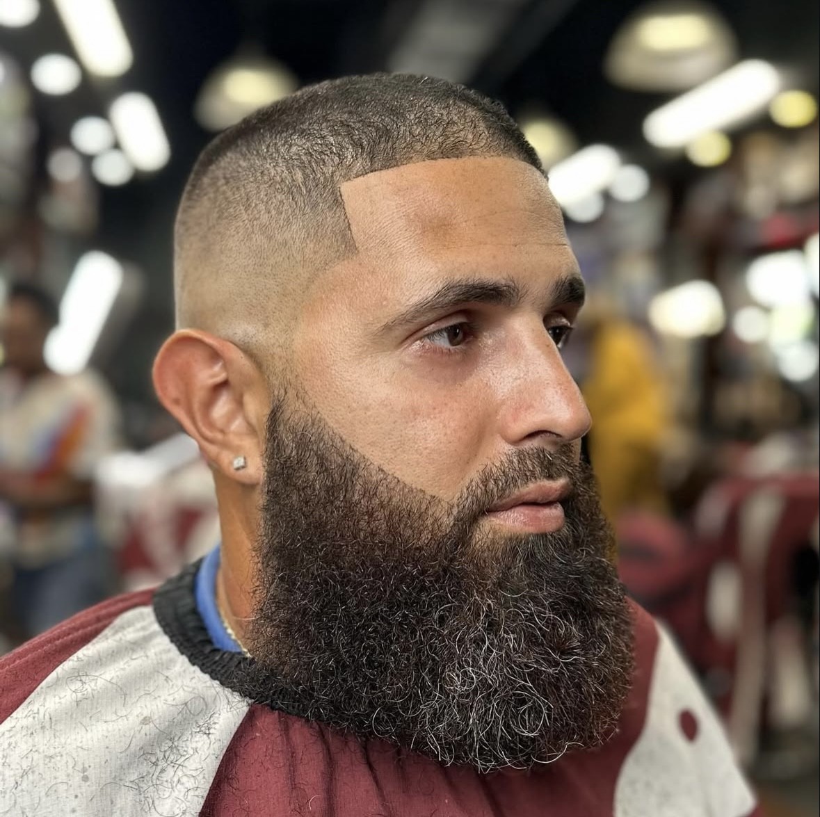 Adrian Velez's skin fade with thick beard