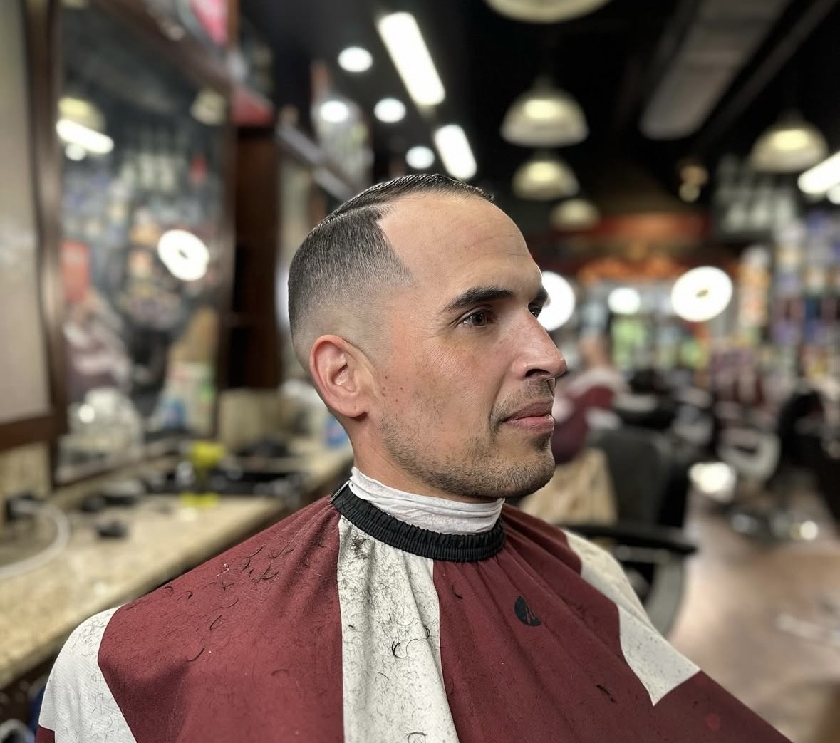 Adrian Velez's expert skin fade in profile view