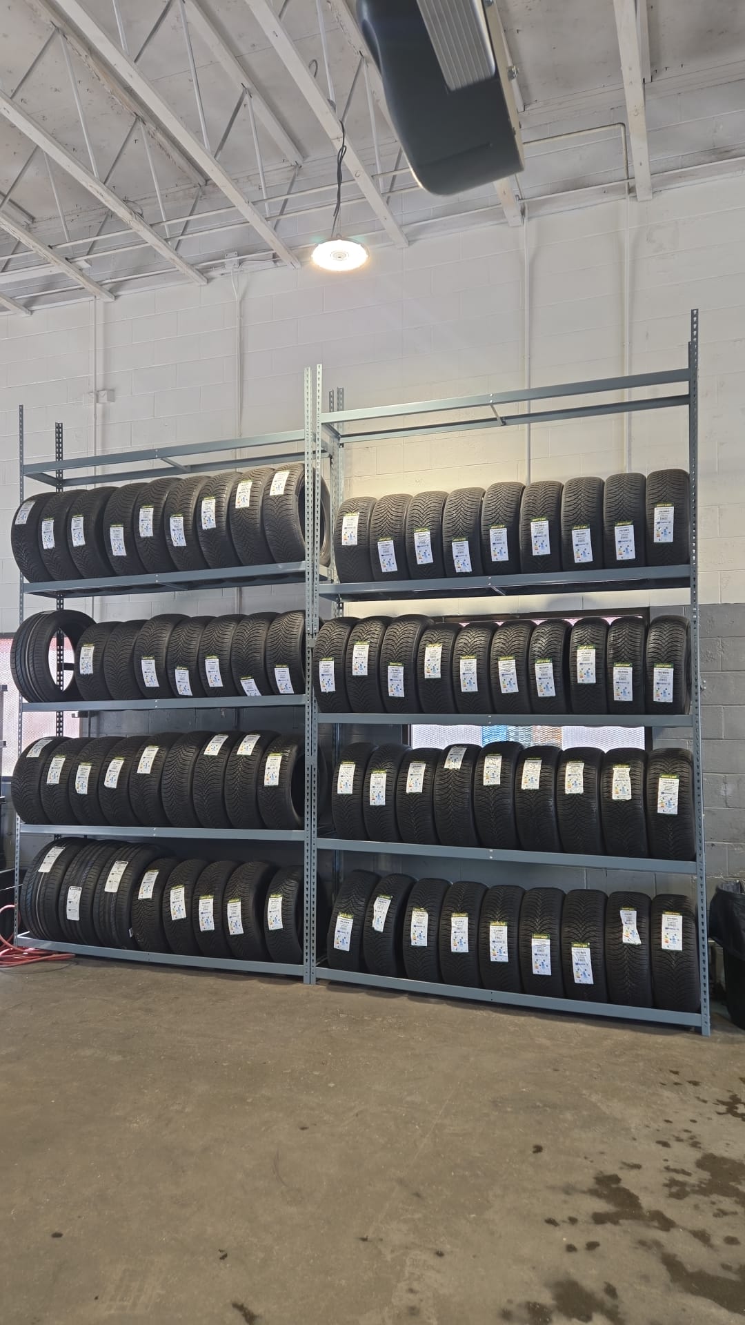 Tire inventory on metal shelving racks