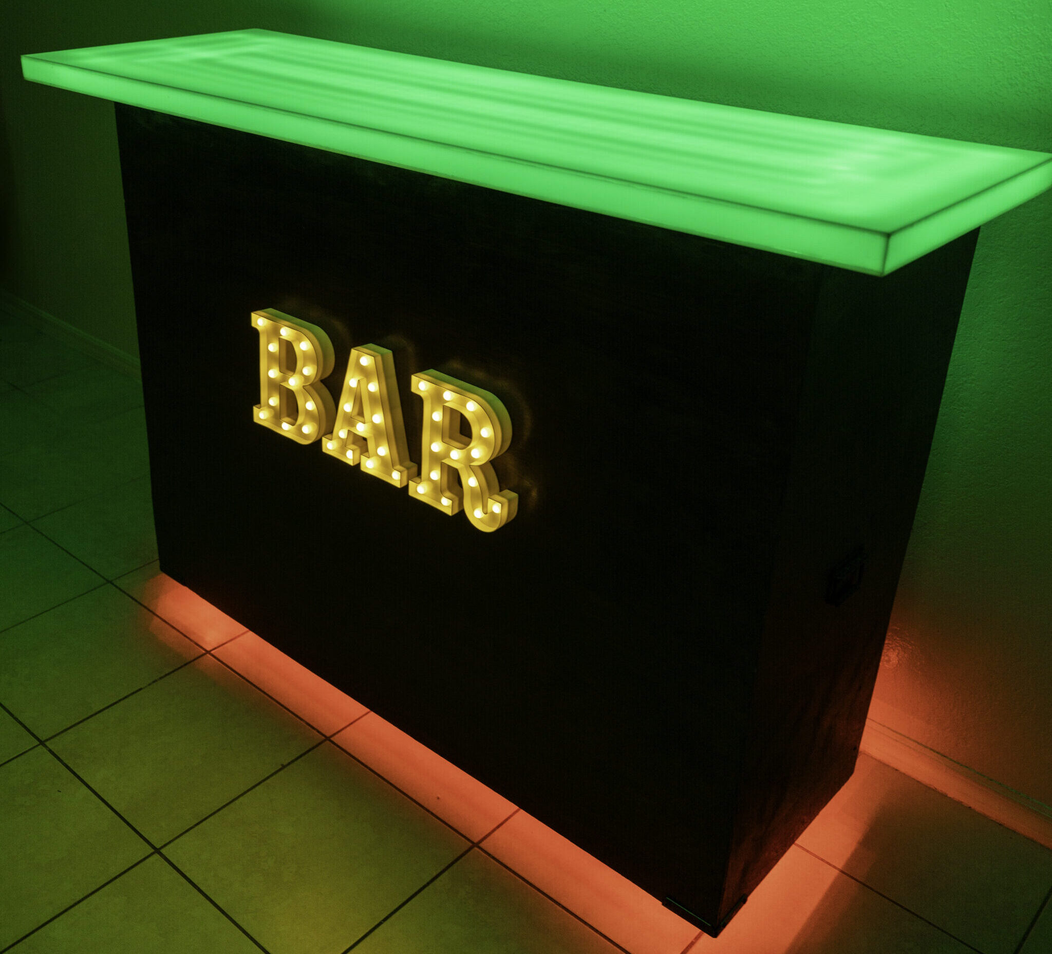 Modern black mobile bar with green LED lighting - event bar rental South Florida