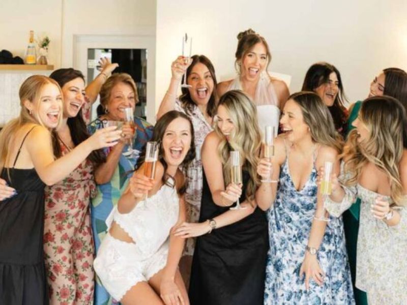 Group of guests toasting with champagne - event bartending South Florida
