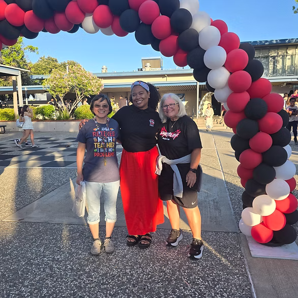Tomara with educators and community leaders celebrating a school event