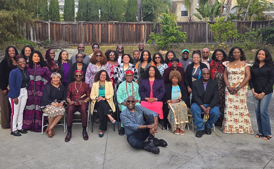 A large, multigenerational group of community supporters gathered together