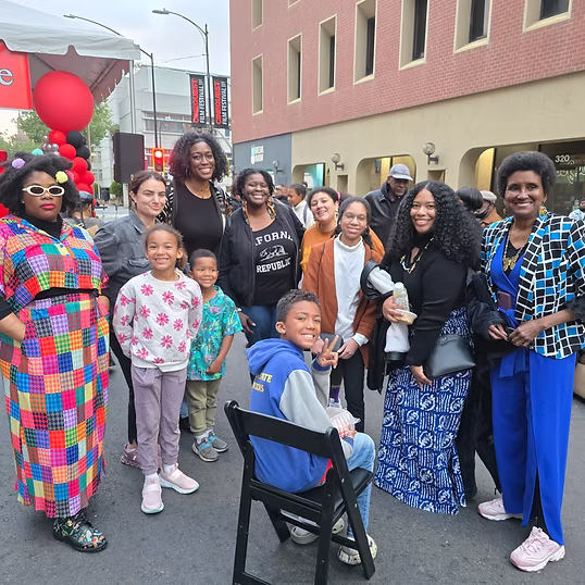 Community members celebrating together at a San Jose street festival