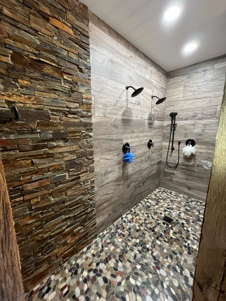Tiled walk-in shower installed by New Creation Plumbing