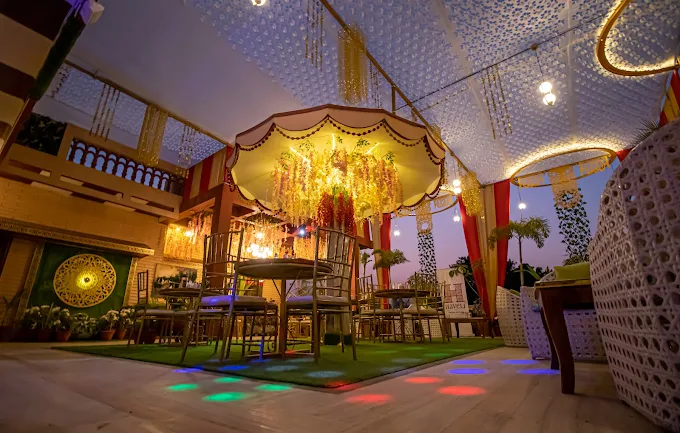 Rooftop dining area decorated with floral canopy and festive lights