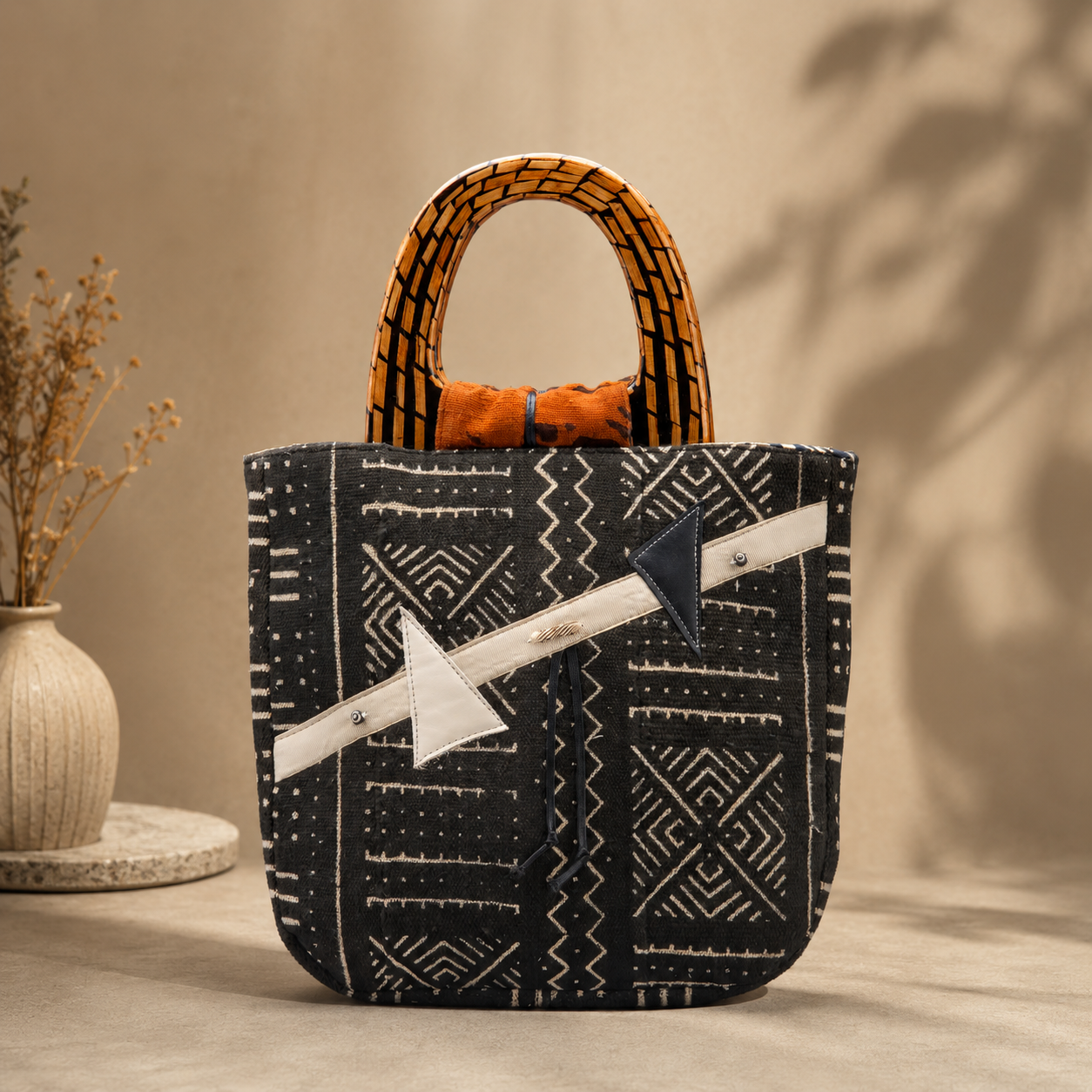 Black mudcloth U-Bag with geometric patterns and bamboo handles