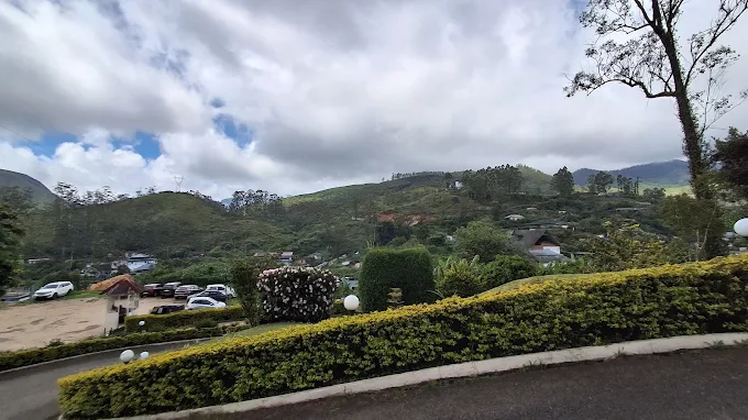 Cloudy mountain views across the green hills surrounding the property