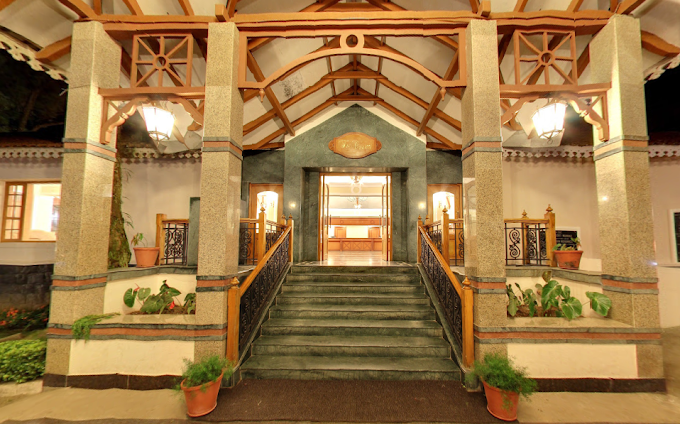 Welcoming Tea County entrance hall with timber beams and warm lighting