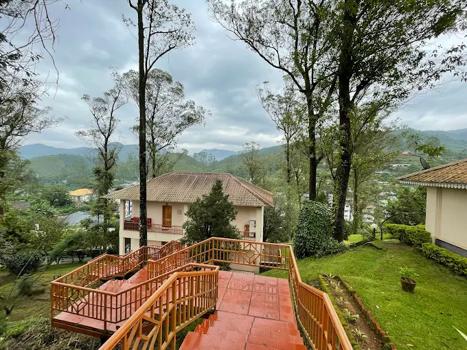 Terrace steps overlooking Tea County cottages and the wooded hills