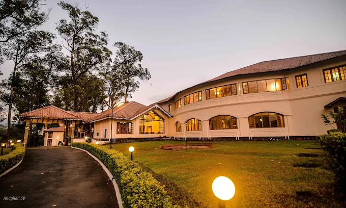 Tea County hotel glowing with warm lights at dusk