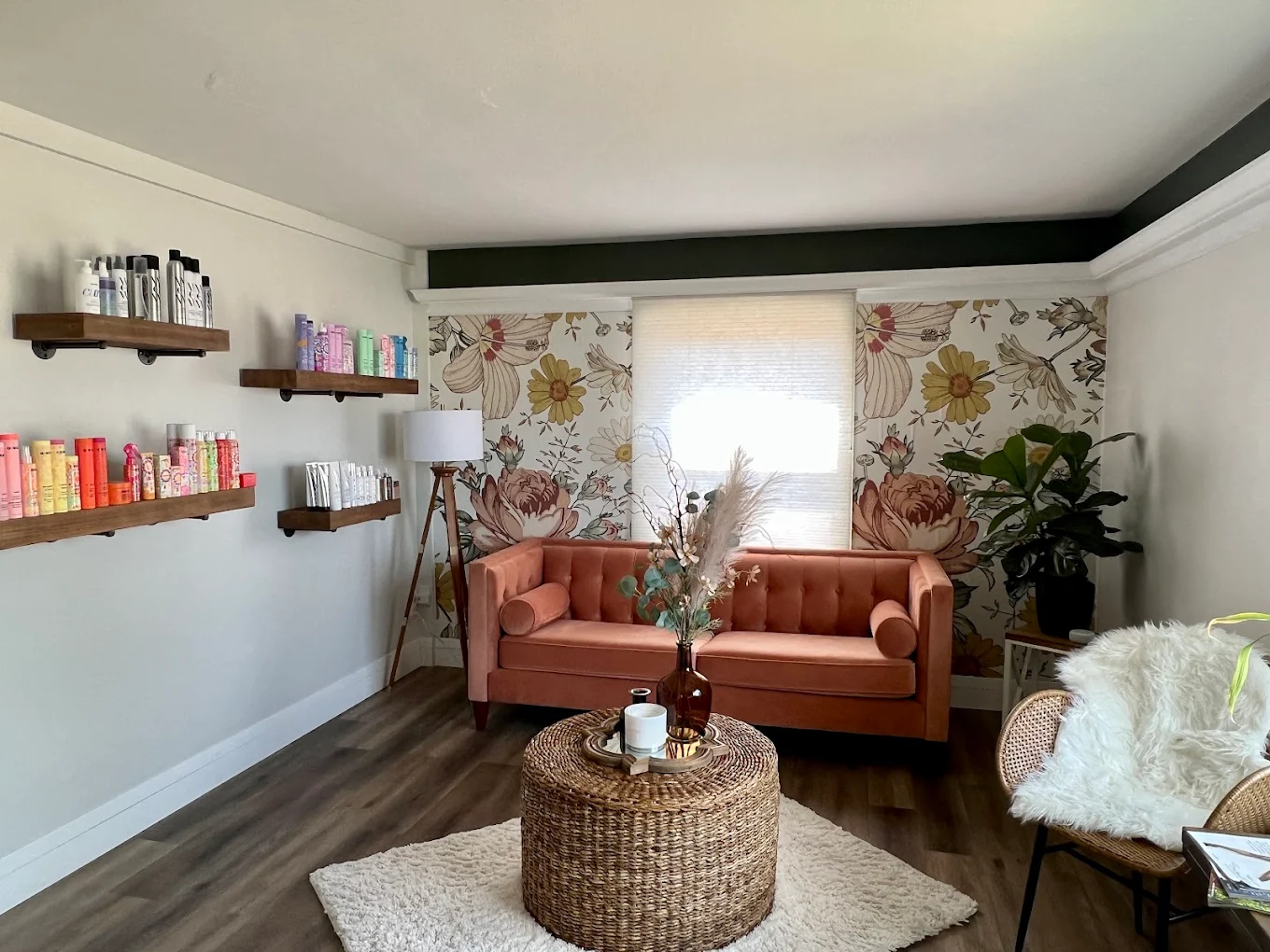Arte Bella Salon waiting lounge with terracotta sofas and floral wallpaper