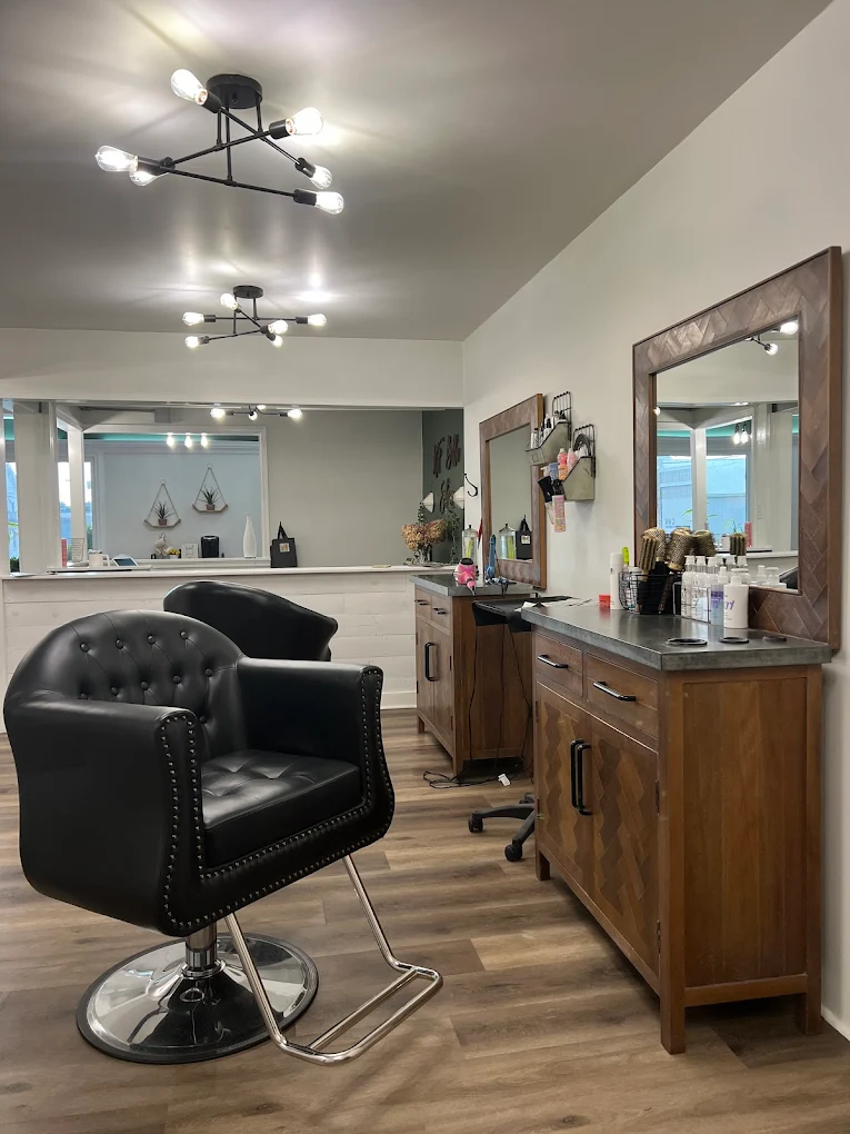 Professional styling station with black leather chair