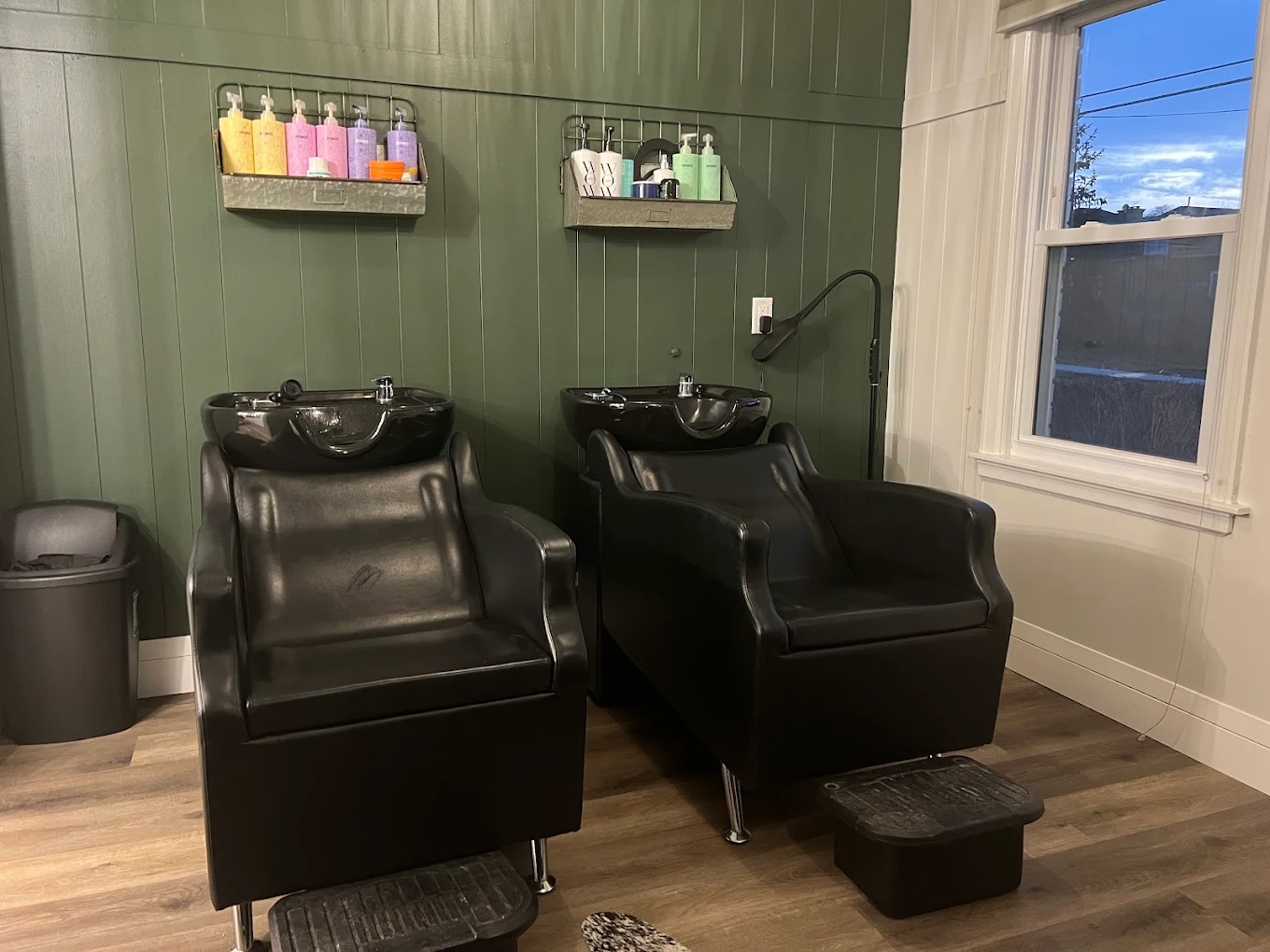 Shampoo stations with sage green wall