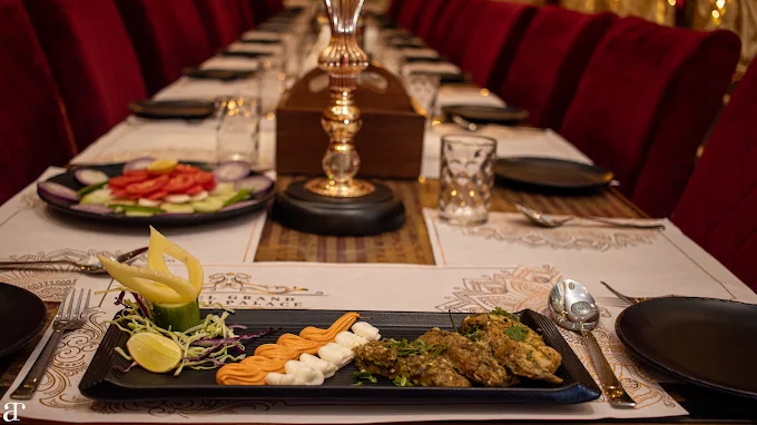 Plated kebab platter served at an elegantly set dining table