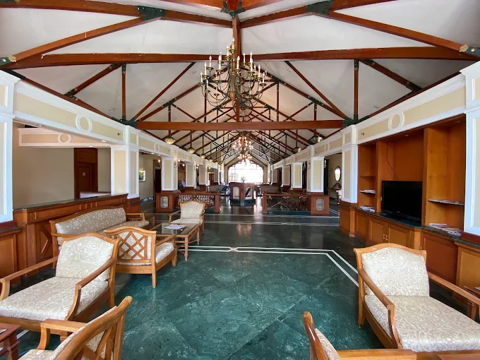 Spacious hotel lounge with comfortable seating and timber beams