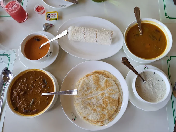 Traditional breakfast spread with idli, dosa, curries and chutneys