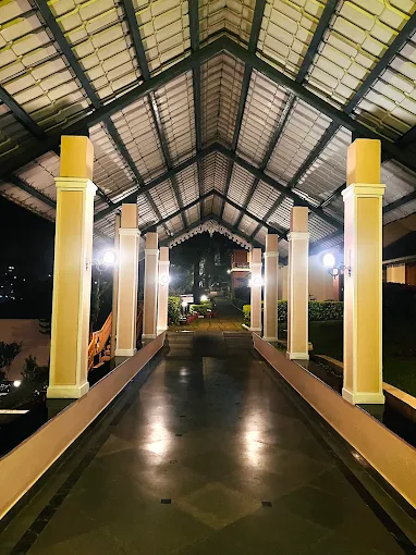 Covered outdoor walkway illuminated at night