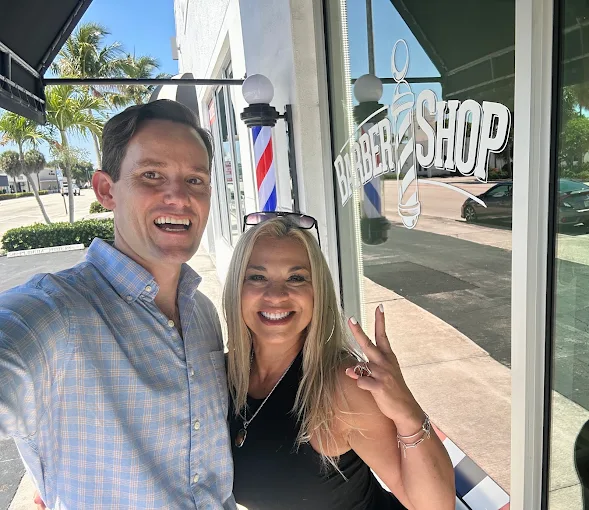 Happy customers at Barba Shop storefront