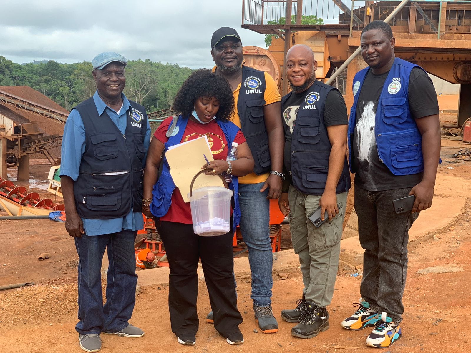 UWUL officials in vests at mining site