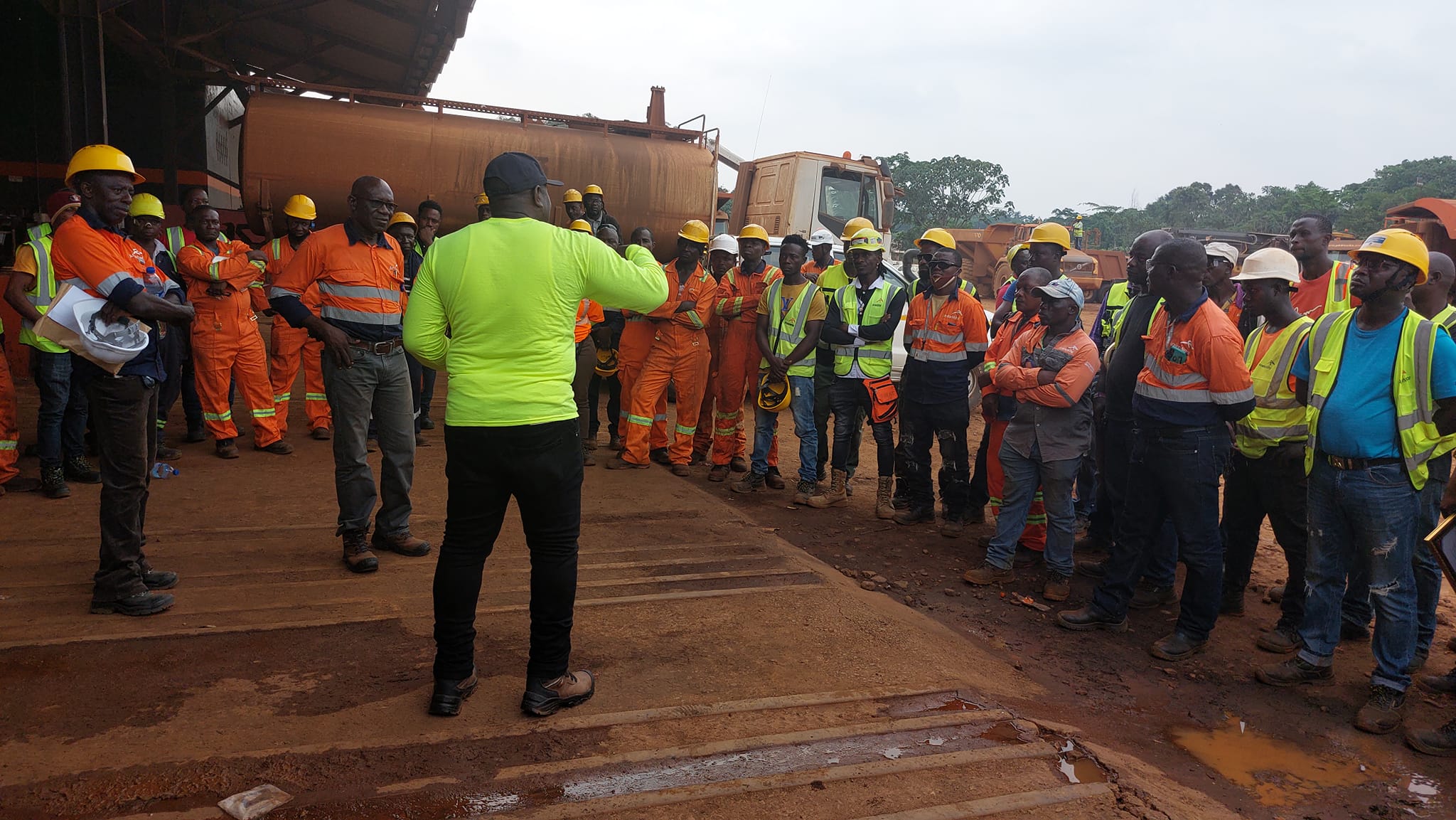 Union representative speaking to workers