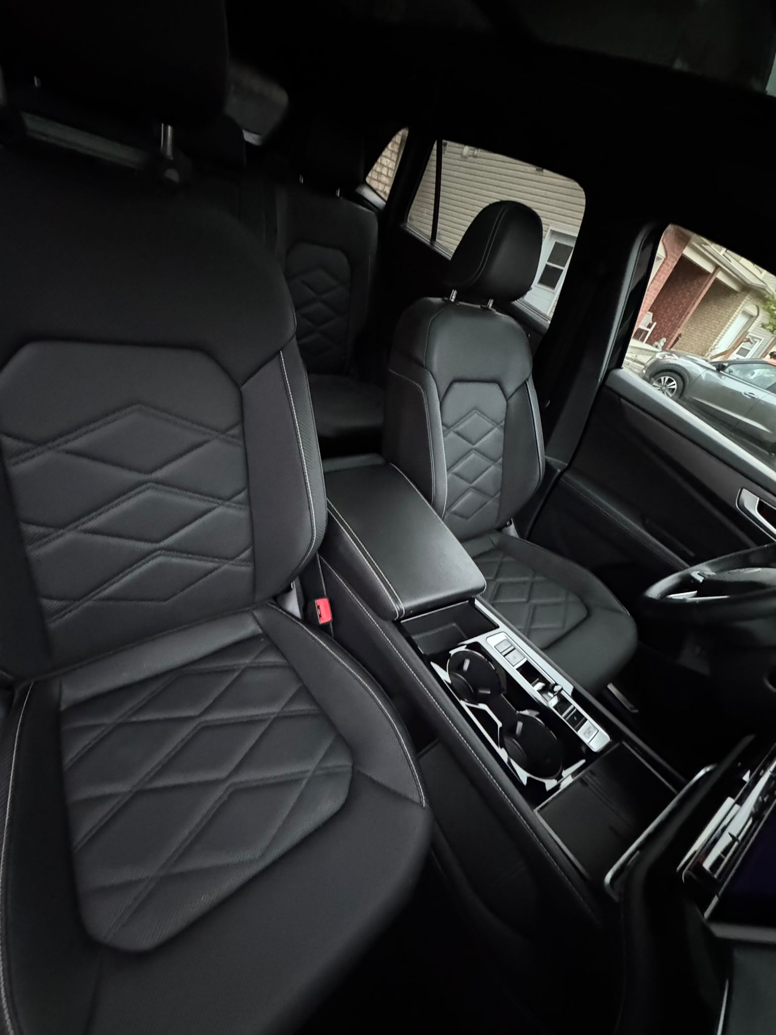 Diamond-stitched leather rear seats after deep interior clean