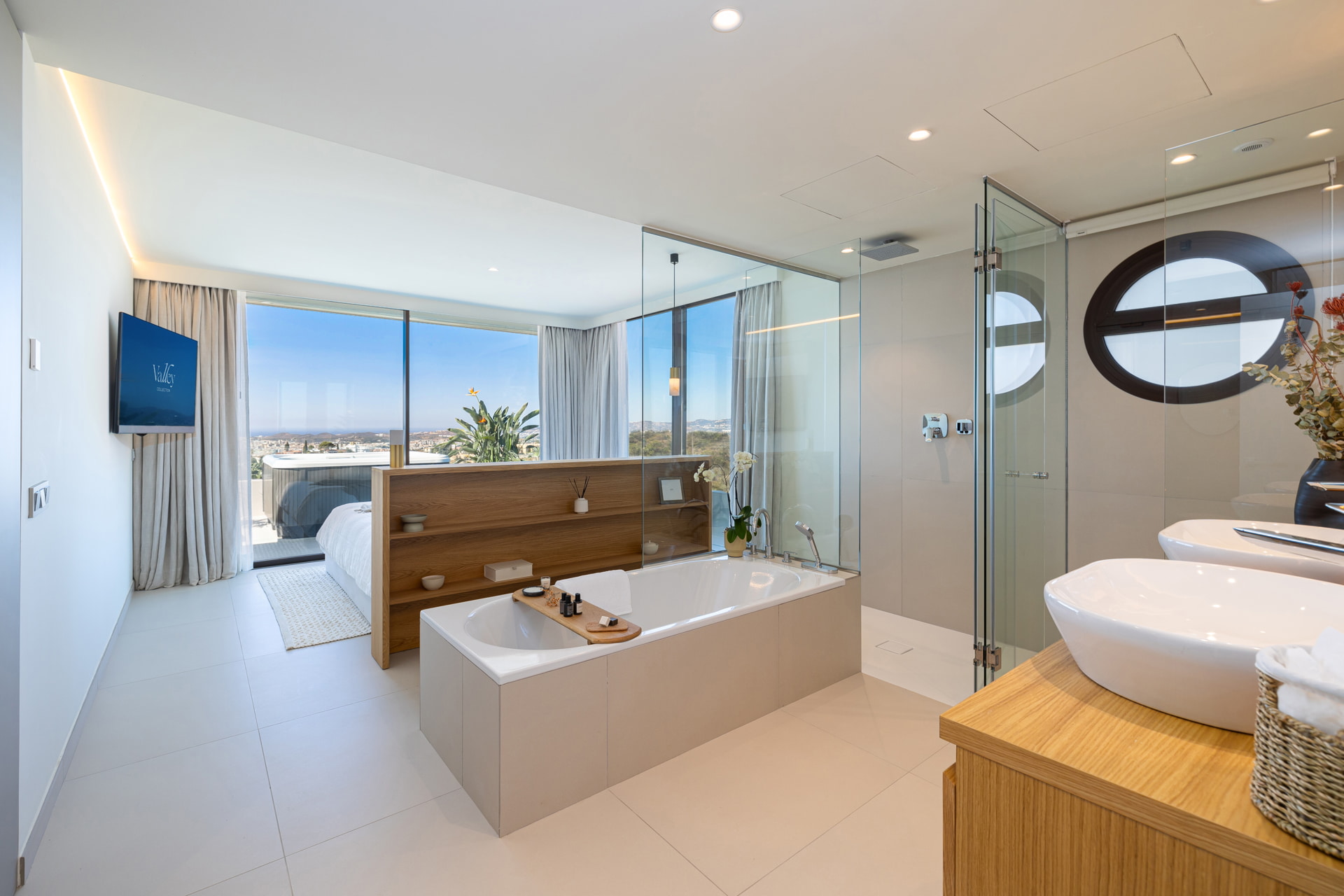 Luxury open-concept bathroom with panoramic views