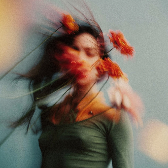Portrait with flowers in motion