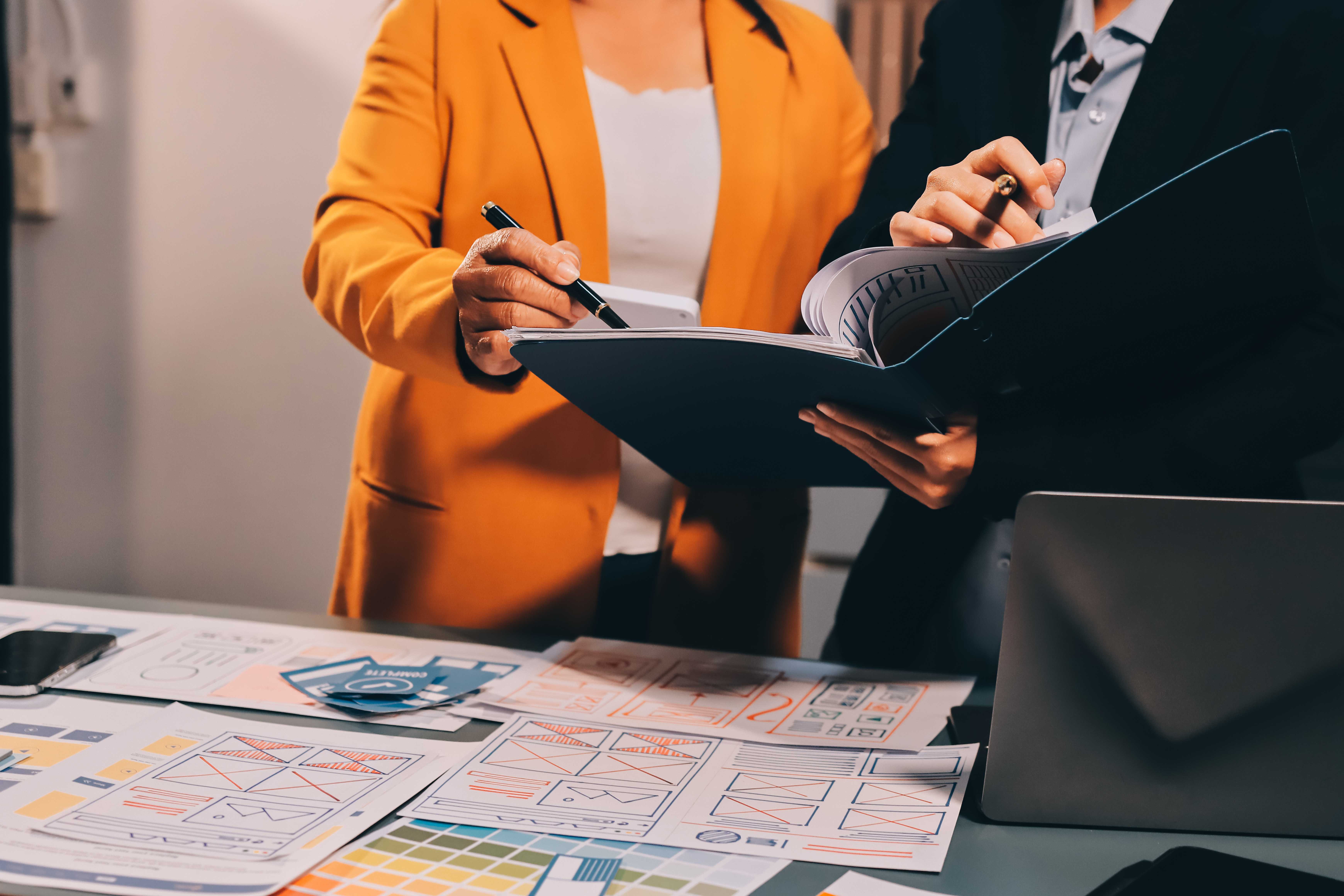 Consultants reviewing a tender document