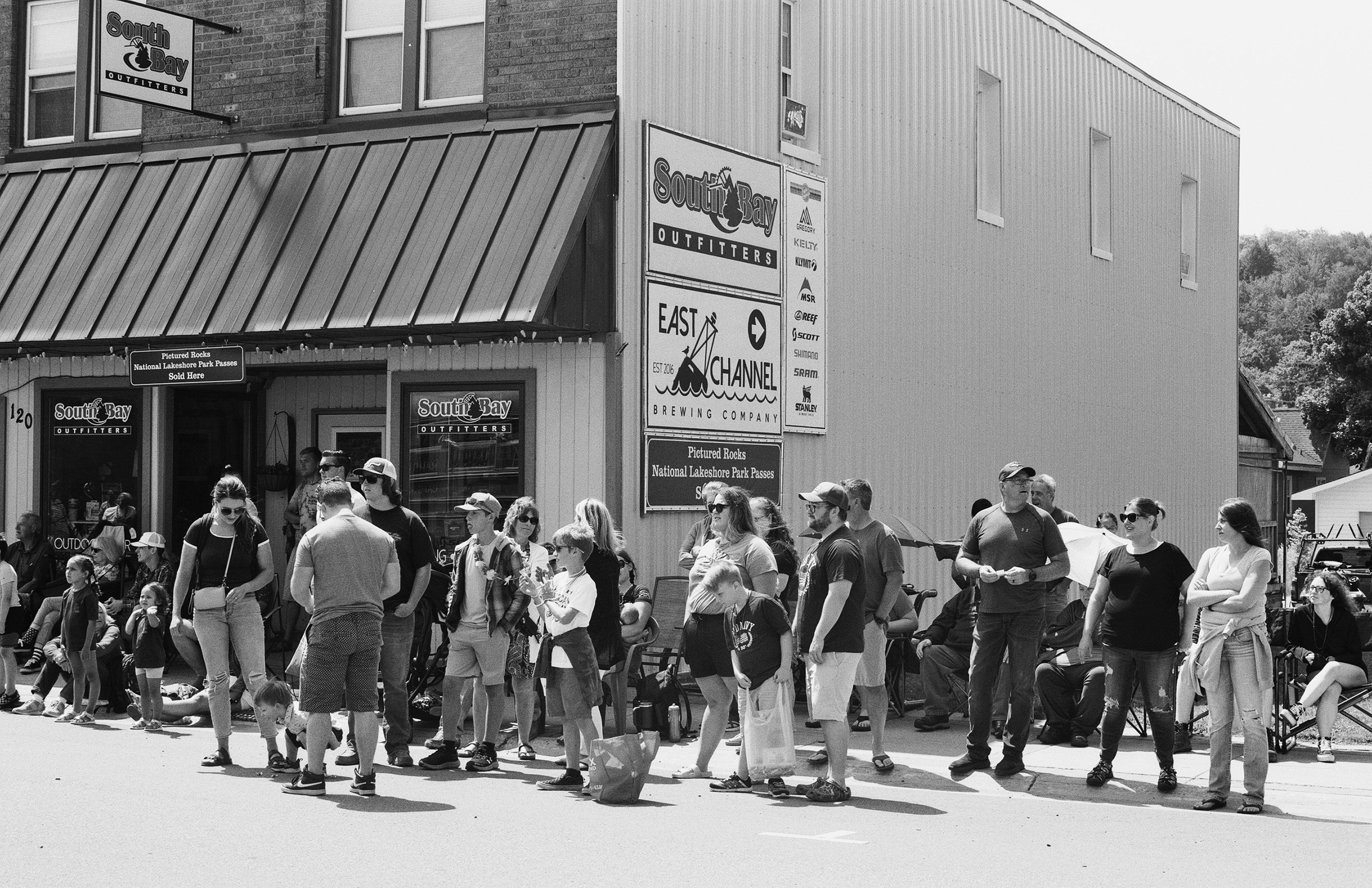 South Bay Outfitters storefront with large crowd gathered outside during event