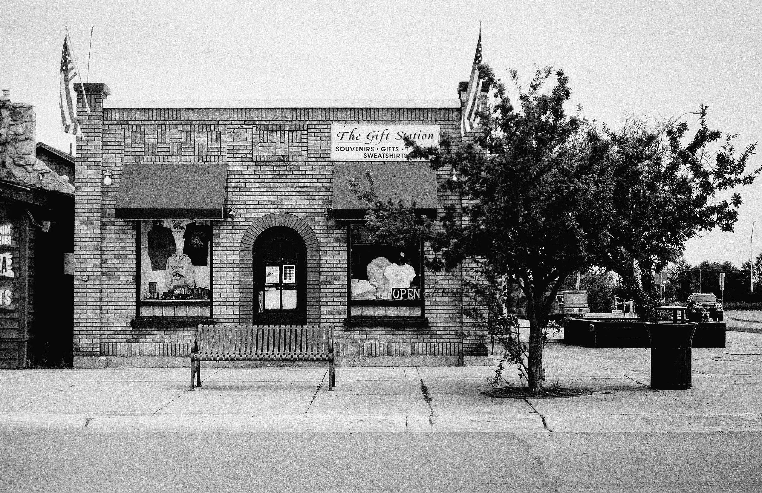 The Gift Station storefront with souvenir and sweatshirt shop sign and display windows