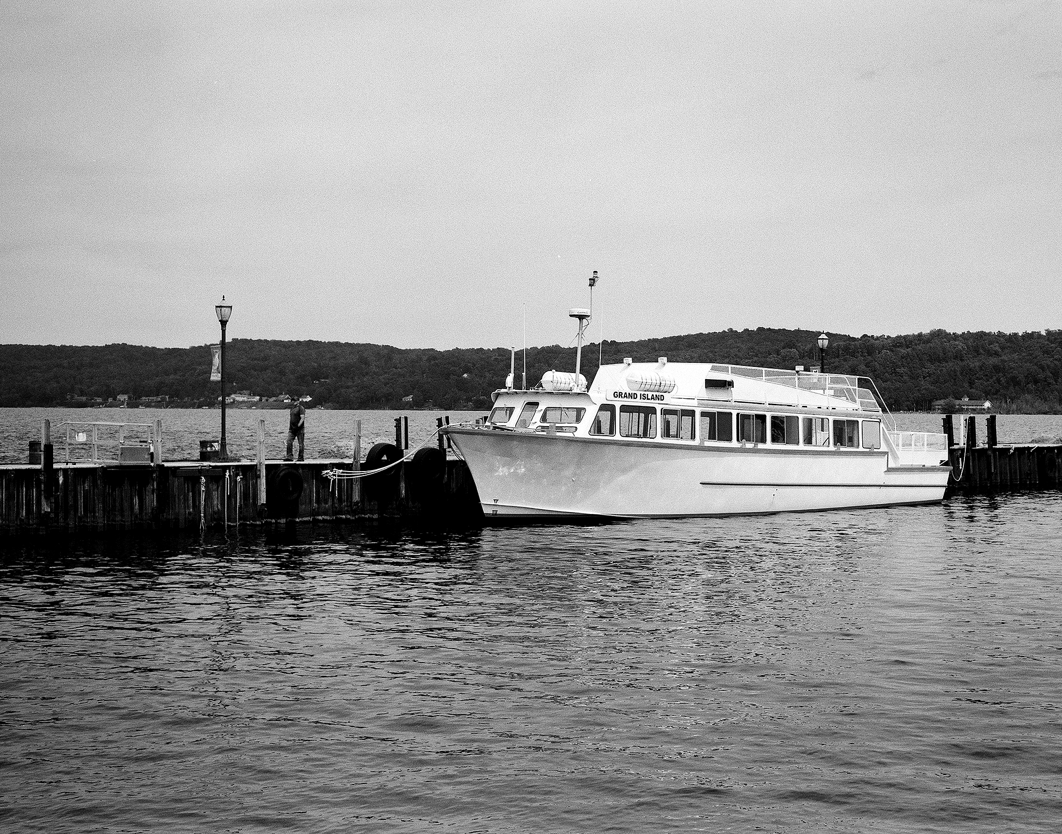 Grand Island passenger ferry moored at dock with calm water