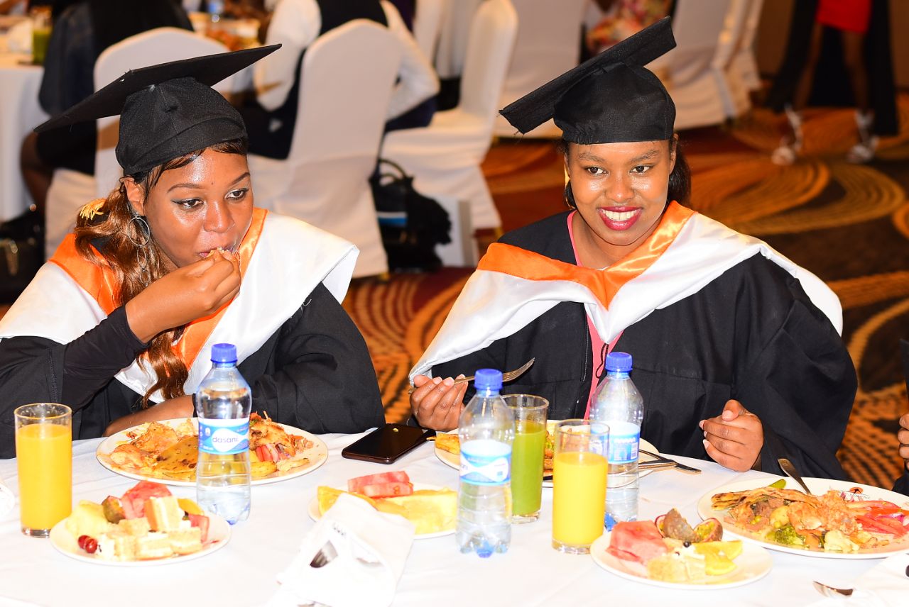 Two female graduates at graduation banquet