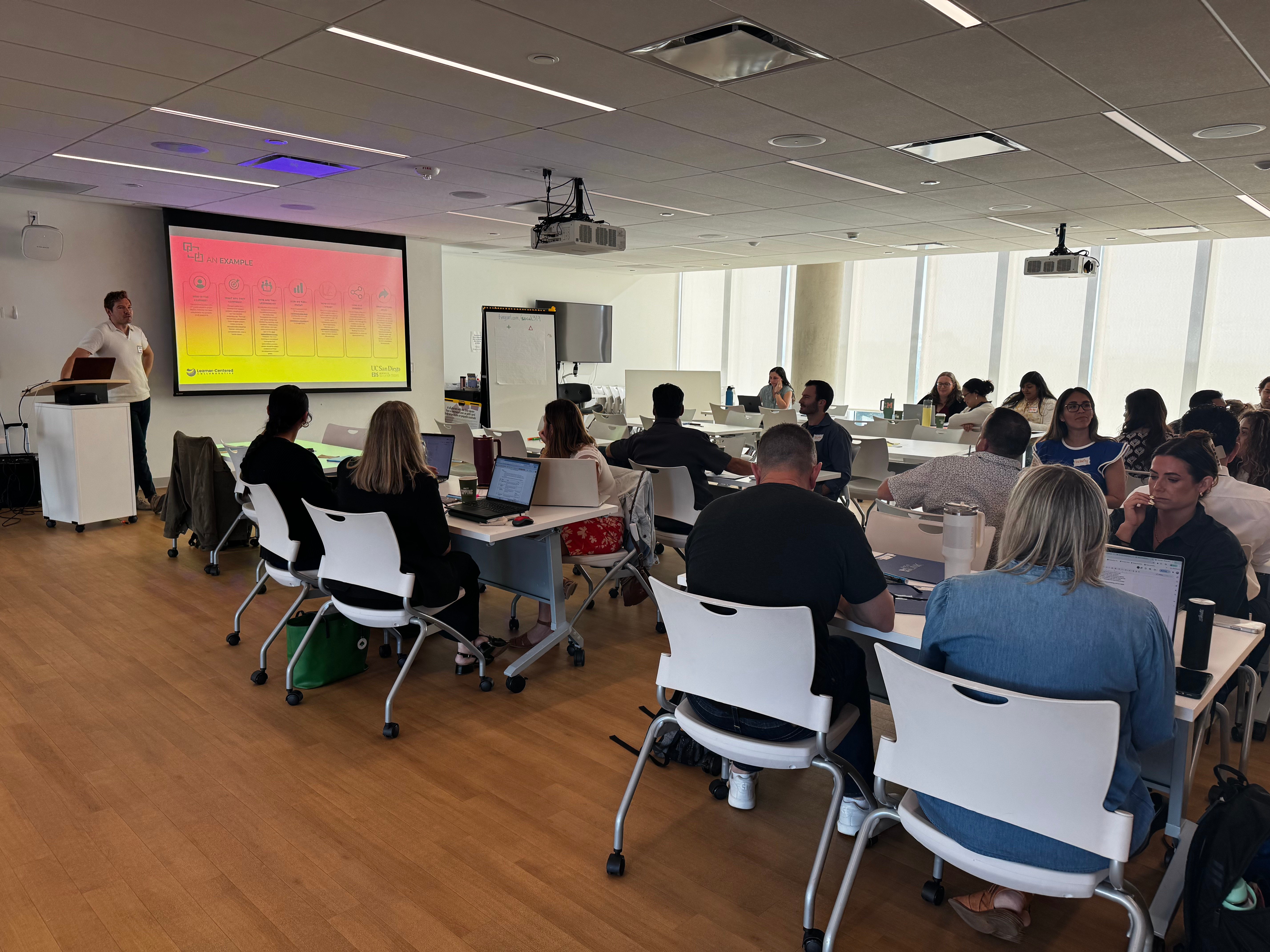 Full room presentation with colorful slide