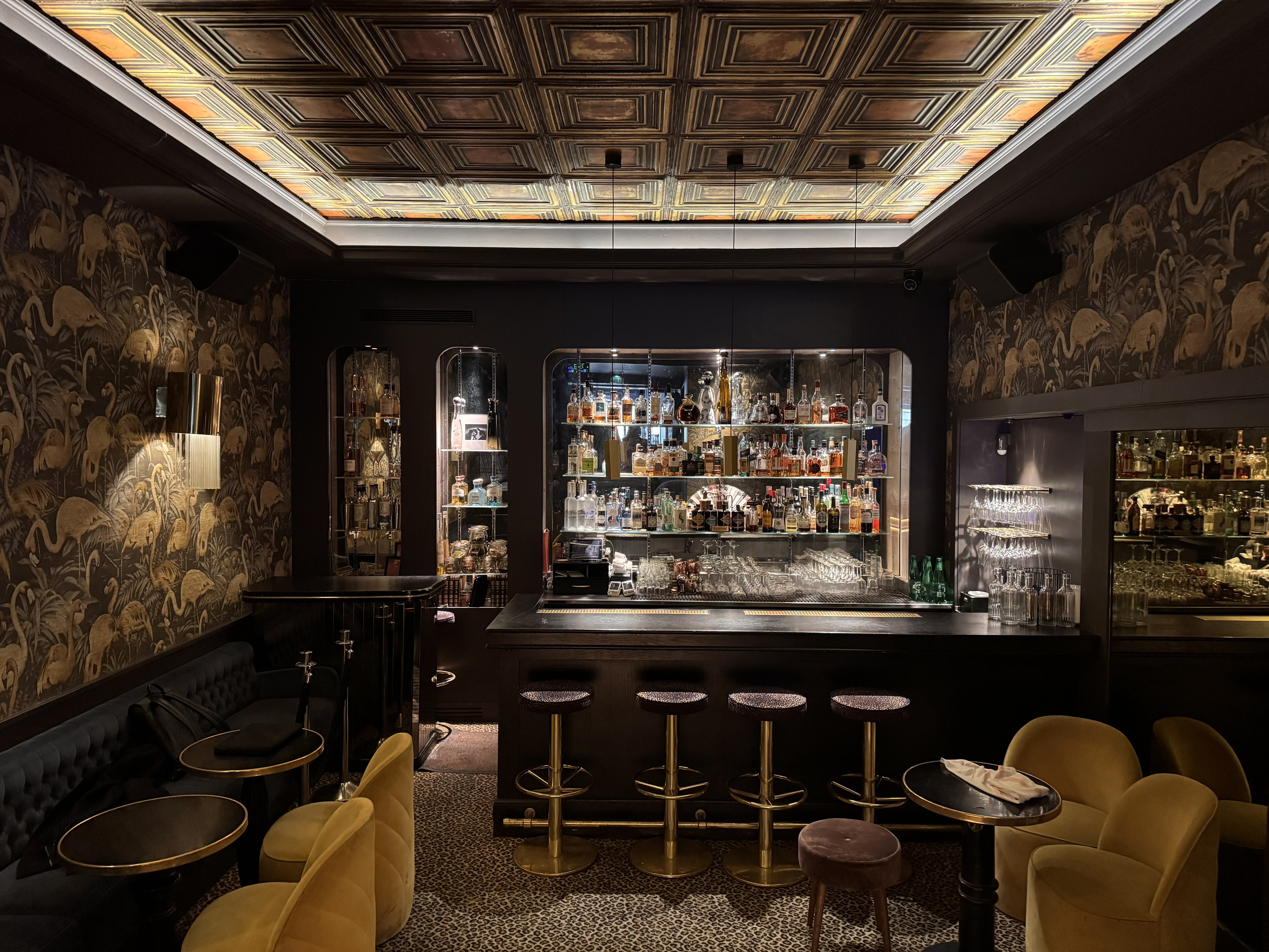 Intimate Paris wine bar with golden lighting