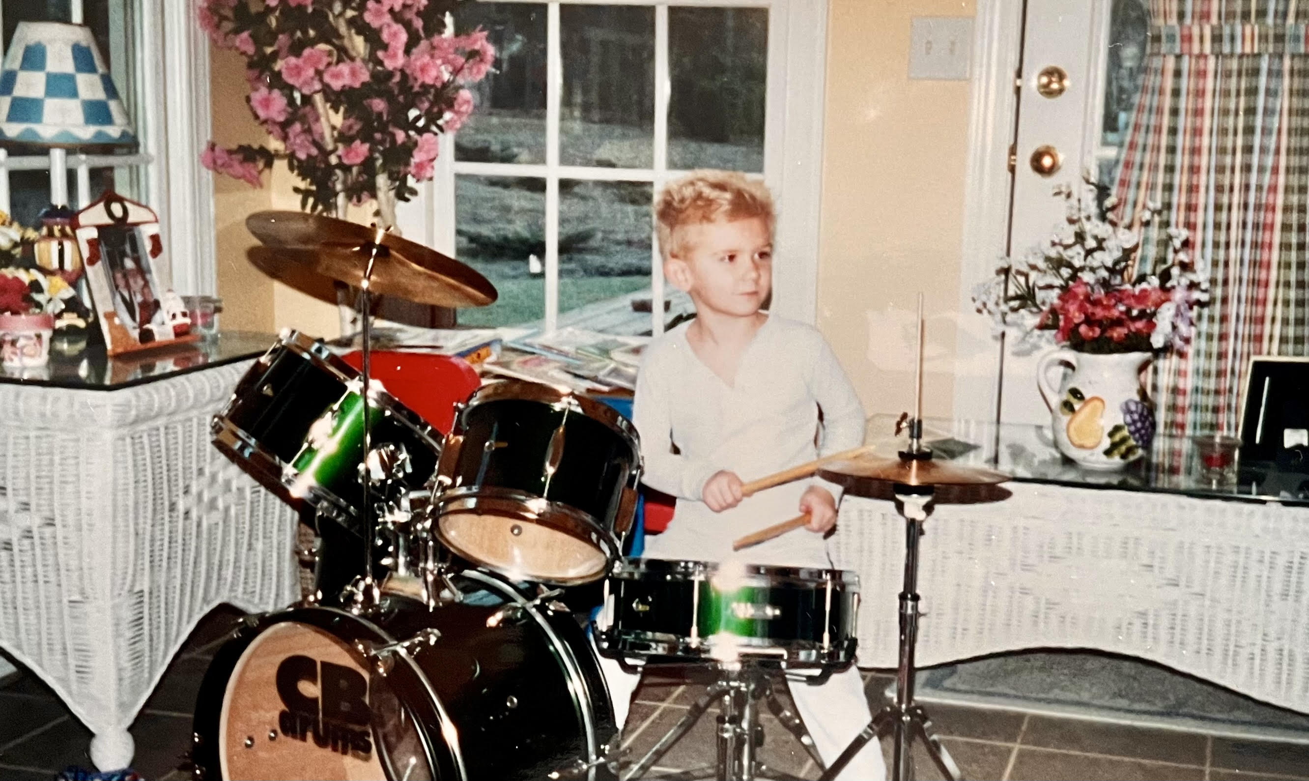 Dylan as a young child playing drums