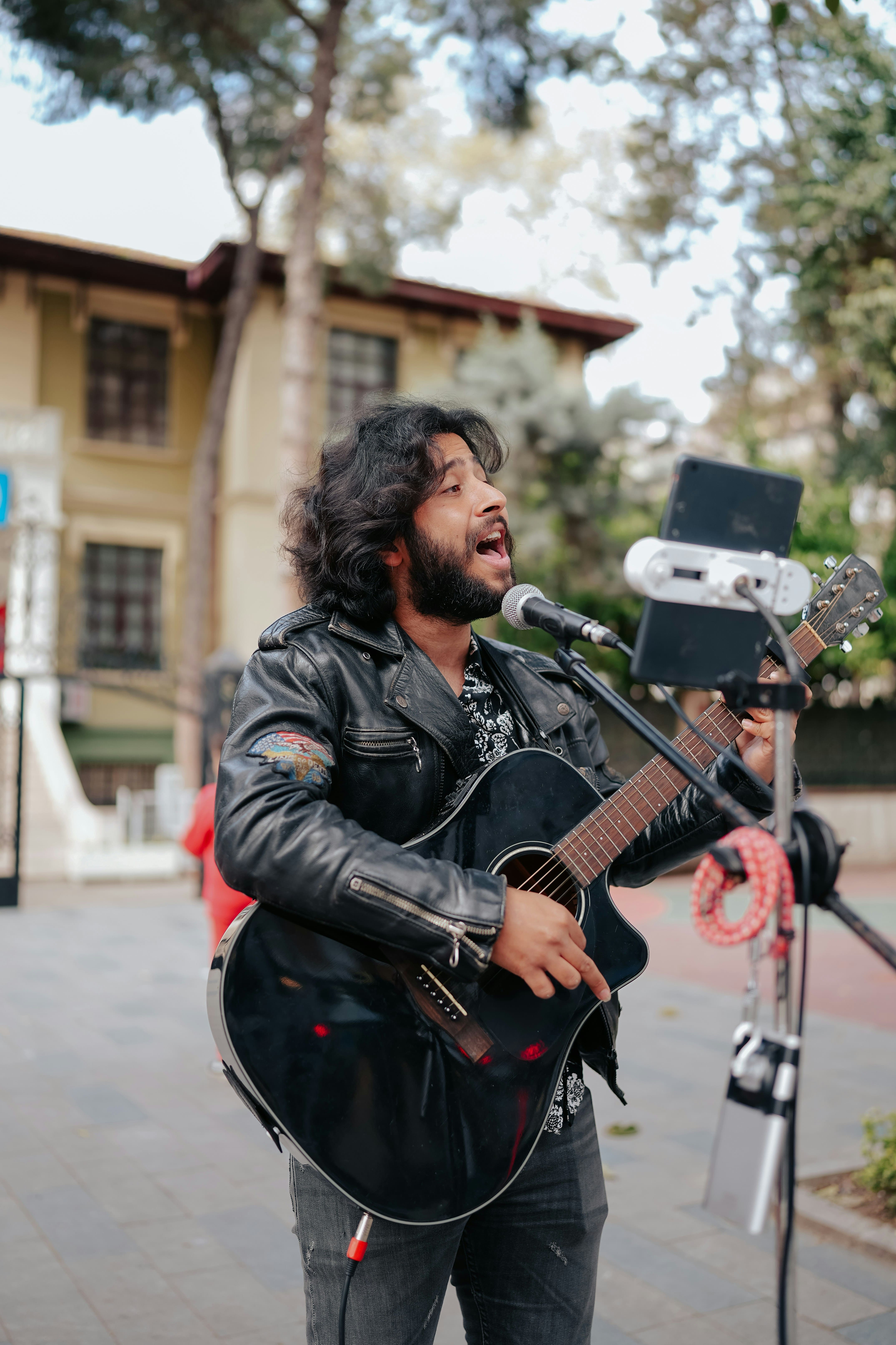 Street musician singing with guitar